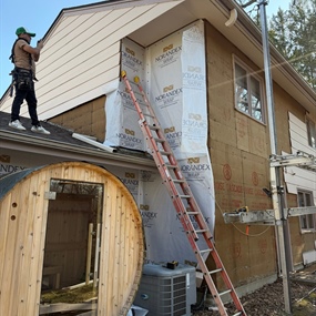 Siding installation underway on upper level of Prior Lake home